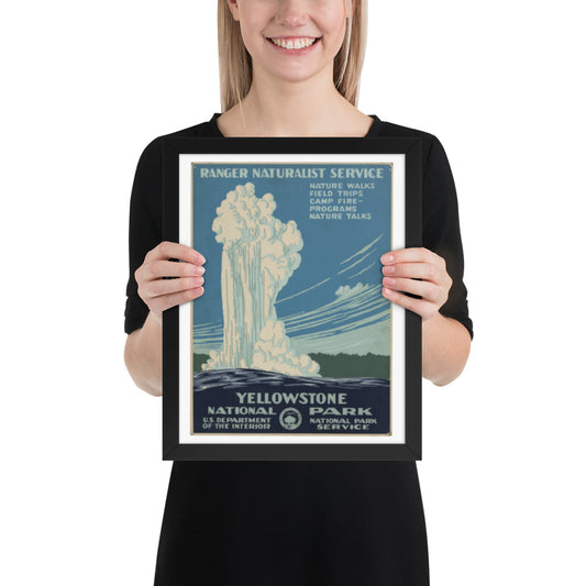Person holding a framed Yellowstone National Park poster