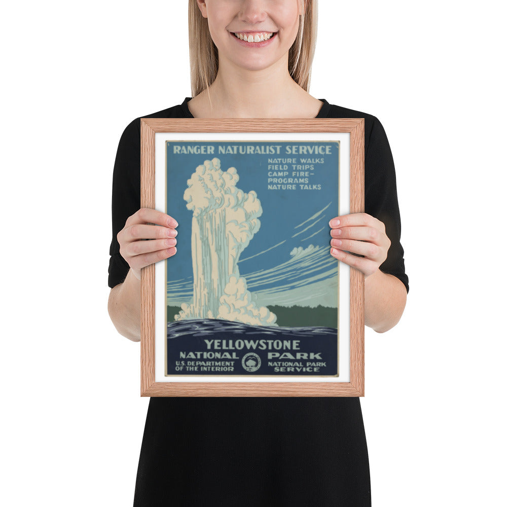 Person holding a framed Yellowstone National Park poster