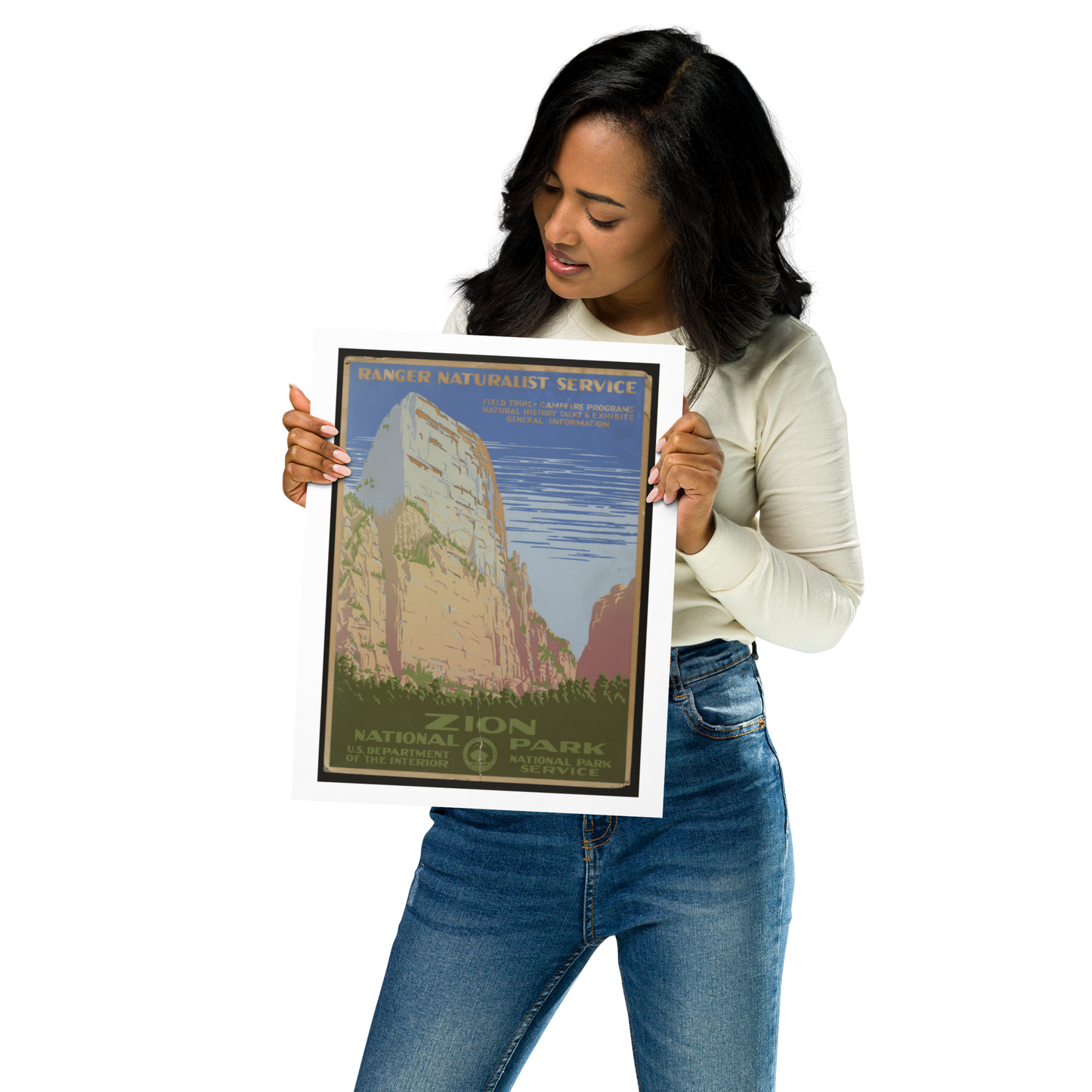 Woman holding a Zion National Park poster against a white background