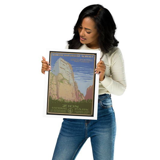 Woman holding a Zion National Park poster against a white background