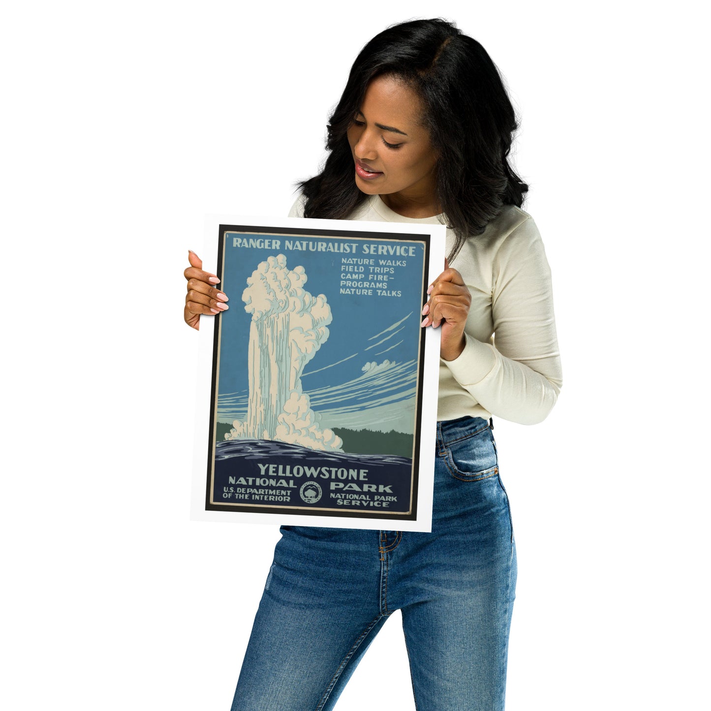Woman holding a Yellowstone National Park poster against a white background